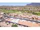 Residential area featuring well-maintained homes, desert landscaping, and a nearby golf course at 8785 E Greenview Dr, Gold Canyon, AZ 85118