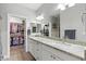 Bathroom with double sinks, granite countertop, and walk-in closets at 8785 E Greenview Dr, Gold Canyon, AZ 85118