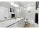 Bright bathroom featuring white cabinets, granite counters, and a soaking tub at 8785 E Greenview Dr, Gold Canyon, AZ 85118