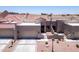 Charming townhome with a two-car garage, desert landscaping, and a red tile roof at 8785 E Greenview Dr, Gold Canyon, AZ 85118