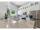 Modern kitchen features granite countertops, stainless steel appliances, custom white cabinets, and abundant natural light at 8785 E Greenview Dr, Gold Canyon, AZ 85118