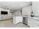 Well-designed kitchen with island seating, modern appliances, and an open layout seamlessly connecting to the living room area at 8785 E Greenview Dr, Gold Canyon, AZ 85118