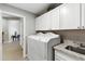 Clean laundry room featuring a modern washer and dryer plus storage at 8785 E Greenview Dr, Gold Canyon, AZ 85118