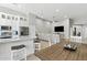 Open-concept layout showcasing the kitchen island, living room sectional, and dining area, perfect for entertaining and Gathering life at 8785 E Greenview Dr, Gold Canyon, AZ 85118