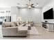 Inviting living room boasting a comfortable sectional sofa, entertainment center with fireplace, and ample space for relaxation at 8785 E Greenview Dr, Gold Canyon, AZ 85118