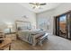 Spacious main bedroom with a bench, large window, and access to the patio at 8785 E Greenview Dr, Gold Canyon, AZ 85118