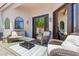 Cozy outdoor patio with comfortable wicker furniture and pea gravel at 8785 E Greenview Dr, Gold Canyon, AZ 85118