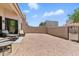 Spacious outdoor patio with wicker furniture and a large pea gravel area at 8785 E Greenview Dr, Gold Canyon, AZ 85118