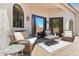 Cozy outdoor patio with comfortable wicker furniture and pea gravel at 8785 E Greenview Dr, Gold Canyon, AZ 85118
