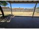 Covered patio overlooking a large yard with block fence offers space for outdoor relaxation and entertainment at 8936 W Mackenzie Dr, Phoenix, AZ 85037