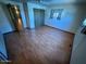 Spacious bedroom with hardwood floors, closet and natural light creating a bright and airy feel at 9501 E Broadway Rd # 68, Mesa, AZ 85208