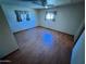 Bedroom featuring hardwood floors and natural light from multiple windows creating a bright and airy feel at 9501 E Broadway Rd # 68, Mesa, AZ 85208
