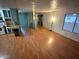 Living room with hardwood floors, big windows with tons of natural light and adjacent kitchen at 9501 E Broadway Rd # 68, Mesa, AZ 85208