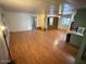 Open-concept living room featuring hardwood floors and views into the kitchen area with natural light at 9501 E Broadway Rd # 68, Mesa, AZ 85208