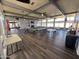 The community space has tables and chairs with a wall of windows to allow natural light at 9501 E Broadway Rd # 68, Mesa, AZ 85208