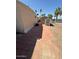 This outdoor view shows the patio area with a shed and other mobile homes nearby at 9501 E Broadway Rd # 68, Mesa, AZ 85208