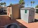 This is an outdoor view of two storage sheds in the community, providing storage for residents at 9501 E Broadway Rd # 68, Mesa, AZ 85208