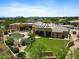 Stunning aerial view of the property, showcasing its large lot, pool, and landscaping at 9693 N 129Th Pl, Scottsdale, AZ 85259
