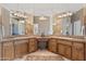 Elegant bathroom features a double vanity, lots of mirror space and cabinet space at 9693 N 129Th Pl, Scottsdale, AZ 85259