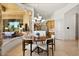 Inviting breakfast nook with large windows, modern lighting and views of an adjacent seating area at 9693 N 129Th Pl, Scottsdale, AZ 85259