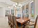 Dining room features a large wooden table and seating for at least eight at 9693 N 129Th Pl, Scottsdale, AZ 85259