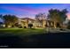 Charming single-story home with manicured lawn, desert landscaping, and covered porch at 9693 N 129Th Pl, Scottsdale, AZ 85259