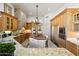 Well-equipped kitchen with granite countertops, an island, stainless steel appliances, and stylish lighting at 9693 N 129Th Pl, Scottsdale, AZ 85259