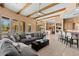 Open-concept living room with large windows, comfortable seating, and modern decor at 9693 N 129Th Pl, Scottsdale, AZ 85259