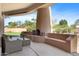 Outdoor covered patio with built in fireplace at 9693 N 129Th Pl, Scottsdale, AZ 85259