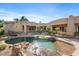 Backyard oasis with a custom pool, spa, and tranquil landscaping perfect for entertaining or relaxation at 9693 N 129Th Pl, Scottsdale, AZ 85259