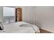 Bedroom with a large window, wooden bookshelf and a white closet at 101 N 7Th St # 225, Phoenix, AZ 85034