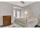 Bedroom featuring white metal bed frame, wooden dresser, and natural lighting at 101 N 7Th St # 225, Phoenix, AZ 85034