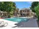 Community pool with relaxing lounge chairs for residents in lush community at 101 N 7Th St # 225, Phoenix, AZ 85034