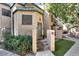 Inviting home exterior featuring landscaped entry, a cozy courtyard, and updated building facade at 101 N 7Th St # 225, Phoenix, AZ 85034