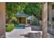 Charming community hot tub with mature trees, and lounge chairs at 101 N 7Th St # 225, Phoenix, AZ 85034