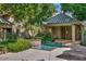 Tranquil community hot tub with lush landscaping and nearby lounging chairs at 101 N 7Th St # 225, Phoenix, AZ 85034