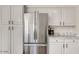 Well-equipped kitchen with stainless steel refrigerator and plentiful cabinet space at 101 N 7Th St # 225, Phoenix, AZ 85034