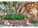 Community signage with beautiful landscaping and mature trees at 101 N 7Th St # 225, Phoenix, AZ 85034