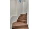 Stylish staircase featuring rich, dark wood steps and sleek white walls and railing at 101 N 7Th St # 225, Phoenix, AZ 85034