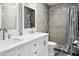 Inviting bathroom with dual sinks, stylish mirror, tiled shower, and a modern design for comfort and elegance at 1015 E Paradise Ln, Phoenix, AZ 85022