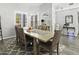 Dining room features a modern chandelier and large window with plantation shutters at 1015 E Paradise Ln, Phoenix, AZ 85022