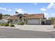 Attractive single-story home with a red tile roof, showcasing a driveway and well-maintained front yard at 1015 E Paradise Ln, Phoenix, AZ 85022