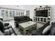 Comfortable living room features a large leather sofa, coffee table, and bright natural light at 1015 E Paradise Ln, Phoenix, AZ 85022