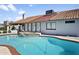 Backyard pool and spa with red brick trim and tile detail, set against the home's exterior and tile roof at 1015 E Paradise Ln, Phoenix, AZ 85022