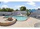 This backyard features a sparkling in-ground pool, hot tub, and stone turtle statue at 1015 E Paradise Ln, Phoenix, AZ 85022