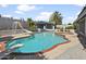 Inviting backyard pool with slide, diving board, spa, and covered patio, perfect for relaxing or entertaining at 1015 E Paradise Ln, Phoenix, AZ 85022