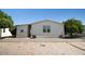 Neat single-story home featuring low-maintenance desert landscaping and convenient outdoor amenities at 11596 W Sierra Dawn Blvd # 182, Surprise, AZ 85378