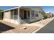 Charming single-story home with a screened-in porch, easy-care landscaping, and convenient covered parking at 11596 W Sierra Dawn Blvd # 182, Surprise, AZ 85378