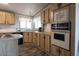 Well-equipped kitchen with wood cabinets, modern appliances, and ample counter space, perfect for cooking and entertaining at 11596 W Sierra Dawn Blvd # 182, Surprise, AZ 85378