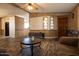 Open-concept living room with a view of the kitchen, and wood-look floors at 11596 W Sierra Dawn Blvd # 182, Surprise, AZ 85378